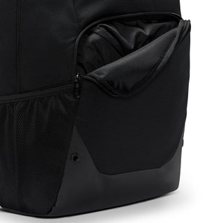Nike Brasilia backpack side close-up with zip pocket, mesh panel, and black exterior.