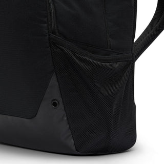 Nike Brasilia backpack lower side view with mesh panel and anchor point grommets.