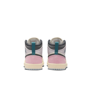 Kids Air Jordan 1 mid-top sneakers, rear view with gray collar and pink heel panel.