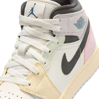Air Jordan 1 Mid youth sneakers close-up, teal wing logo, black swoosh, pastel laces