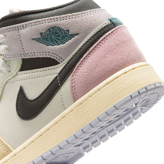 Air Jordan 1 Mid youth sneaker close-up, 'AIR JORDAN' ankle label and pink collar