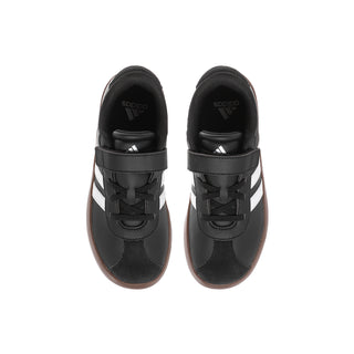 Pair of kids black sneakers with hook-and-loop closure and white triple stripes