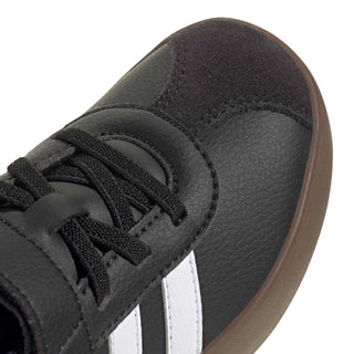 Kids black sneaker upper detail with textured leather and lace-free strap