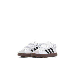 Toddler white sneakers with black 3-Stripes, hook-and-loop straps, brown gum sole.
