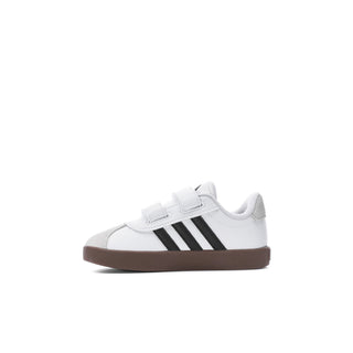 Toddler white sneaker with black 3-Stripes and hook-and-loop strap, gum sole.