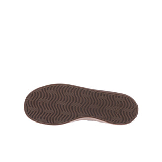 Youth sneaker outsole with wavy tread pattern in brown