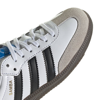 Youth adidas Samba OG sneakers close-up, white leather with black stripes and suede trim