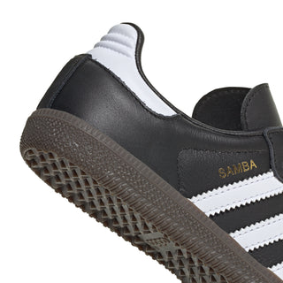 Kids black Samba OG sneaker side detail, white stripes and SAMBA label