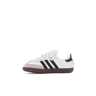 Toddler low-top sneaker in white with black stripes and brown gum sole
