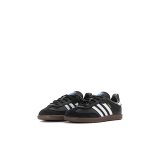 Toddler black and white sneakers, side view, with three stripe detailing and gum sole