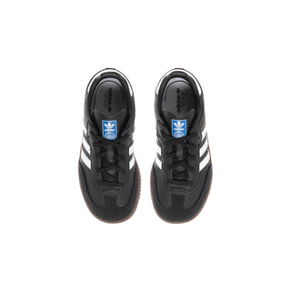 Toddler black sneakers with white stripes and laces, top view