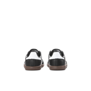 Toddler black sneakers with white stripes, back view with gum heel sole