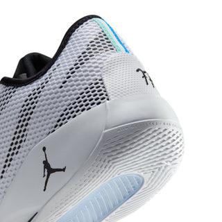 Close-up of shoe side and heel showing white mesh, black logo, and light teal trim