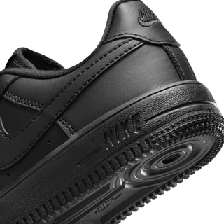 Kids black sneaker close-up of outsole tread and Air-style heel detail
