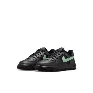 Kids black Nike Force 1 low-top sneakers with mint green side swooshes
