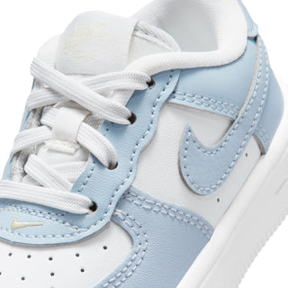 Toddler Air Force 1 sneakers close-up, white laces and light blue swoosh