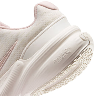 Youth sneaker close-up of cream midsole and cushioned heel, with textured outsole pattern