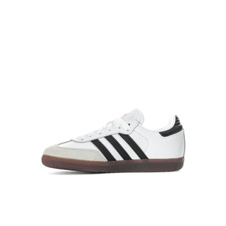 Kids white leather low-top sneaker with black stripes and gum rubber sole