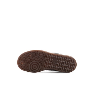 Kids sneaker outsole in brown rubber with tread pattern