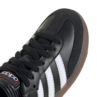 Kids black lace-up sneaker with white stripes, close-up of laces and heel tab