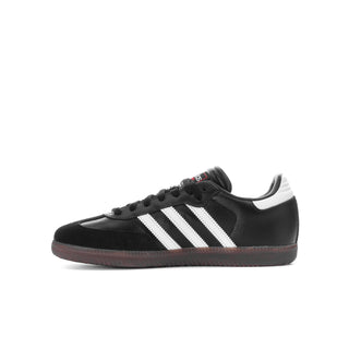 Black youth Samba sneakers side view with white adidas stripes and gum sole