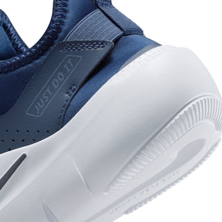 Close-up of youth dark navy side panel with perforations and white outsole edge
