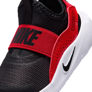 Toddler sneaker close-up: black knit with red strap and white NIKE swoosh