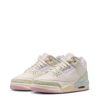 Youth low-top sneakers with white upper, sage side panel and visible Air unit