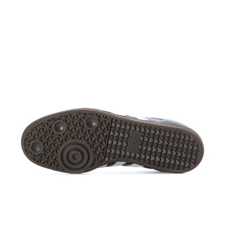 Black adidas sneaker outsole with textured tread and gum rubber base