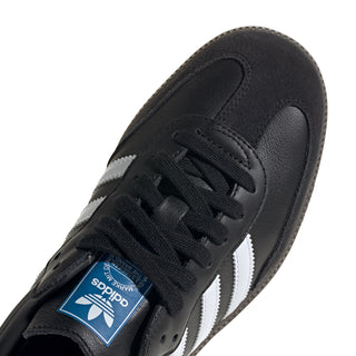 Black adidas sneaker upper detail with lace-up front and white stripe panel