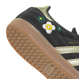Close-up of women’s black Samba sneaker outsole and floral side accents near sole