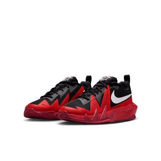 Youth basketball shoes in black and red with white Nike swoosh and lace-up design