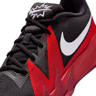 Youth basketball shoe close-up, black textured upper with red V accents and Nike swoosh