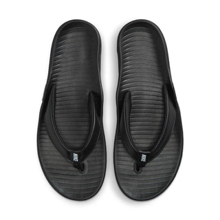 Pair of women’s black thong sandals with contoured, textured footbeds
