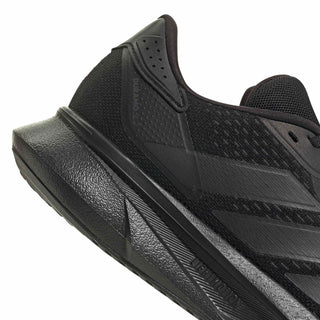 Black running shoe close-up of heel and side, showing supportive overlays