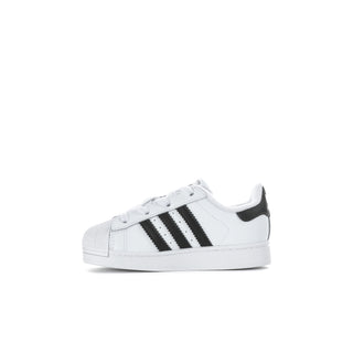 Toddler white sneakers with black striped details and cushioned sole