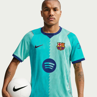 Men's teal soccer jersey with FC Barcelona crest, diagonal pattern, and Nike swoosh