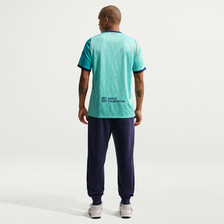 Men's teal soccer jersey back with Barca Foundation text and short sleeves