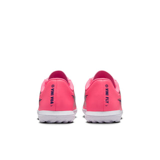 Youth pink soccer shoes with 'VIN VO A' branding at heel and white outsole tread
