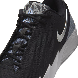 Close-up of men's black shoe upper with lace-up front and gray outsole
