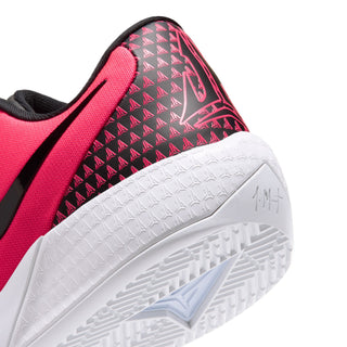 Close-up of bright pink sneaker toe and side texture with white sole and blue traction mark