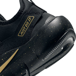 Youth Nike slip-on shoe detail, black upper with gold Just Do It tab and speckled sidewall