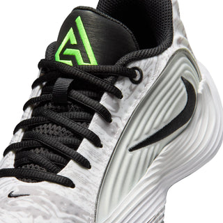 Youth basketball shoe close-up, black laces on white/gray marbled upper with neon logo
