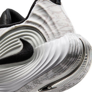 Youth basketball shoe close-up of heel and midsole, white/gray with black accents