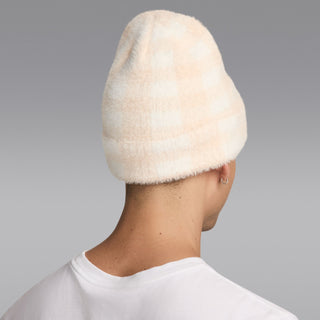Cream plush beanie with folded cuff, back view