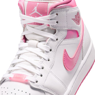 Air Jordan 1 mid-top sneakers close-up, white laces with pink Swoosh and collar accents