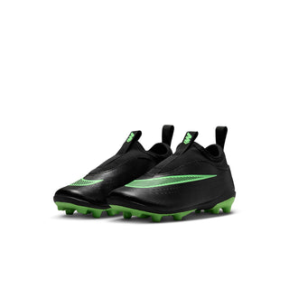 Kids black soccer cleats, side view with green stripes and molded traction studs