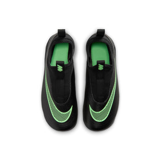 Kids black cleats with green interior lining and laced tongue opening