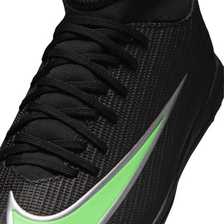 Youth cleat upper close-up with black laces and neon green Swoosh