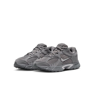 Youth lace-up running shoes in dark gray with layered overlays and cushioned sole